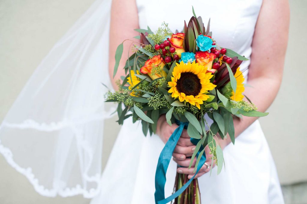 46520584_10156304984376339_2207260096587628544_o-1024x682 Bride holding flowers